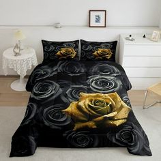 a bed with black and yellow roses on it