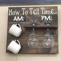 a wooden sign with wine glasses hanging from it's sides and the words how to tell time am pm