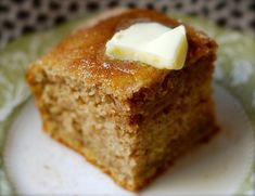 a piece of cake sitting on top of a green and white plate with a bite taken out of it