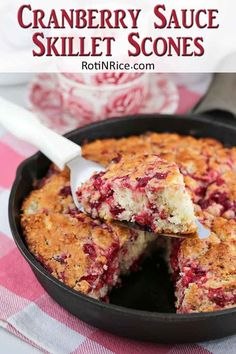 cranberry sauce skillet scones in a cast iron pan with a serving spoon