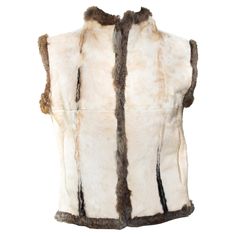 This irresistible Fall/Winter 1999 Gucci reversible calf fur and fur vest was designed by Tom Ford. This vest features tan calf hair on one side and natural-colored rabbit fur on the other. The vest has hook closures and two well-concealed pockets on the calf fur side. The perfect two-in-one, you can't go wrong with this Tom Ford for Gucci creation! Approximate measurements: Size - IT42 Bust: 30” Waist: 35” Shoulder to hem: 22” Fitted White Gucci Outerwear, Gucci White Winter Outerwear, White Gucci Outerwear For Winter, Tom Ford For Gucci, Gucci By Tom Ford, Gucci Coat, Rabbit Fur Vest, Gucci Brand, Gucci Outfits