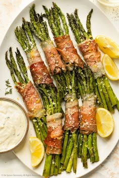 asparagus wrapped in prosciutto and topped with parmesan cheese