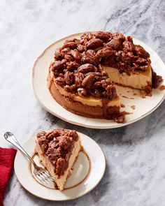 a cheesecake on a plate with a slice cut out and ready to be eaten