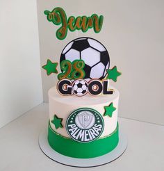 a birthday cake with a soccer ball and stars on it