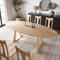 a dining room table and chairs in front of a window