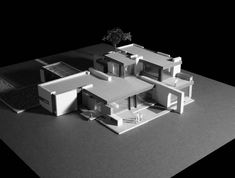 an architectural model of a house in black and white