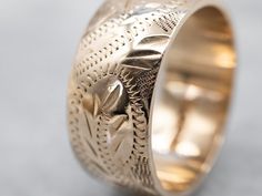 So many wonderful details come together to give this vintage band a rich, textural feel! Crafted of 14 karat yellow gold, this is a great band for stacking or wearing traditional as a wedding band!Metal: 14K Yellow GoldWidth of Band: 8.0 mmHeight off Finger: 1.4 mmRing Size: 6Marks: “<14K>” Stamped on the inside band Formal Heirloom Stackable Rings With Thick Band, Engraved 14k Yellow Gold Bands, 14k Yellow Gold Engraved Bands, Heirloom Engraved Stackable Ring For Formal Occasions, Heirloom 14k Gold Wedding Band Thick Shape, Heirloom Yellow Gold Hallmarked Bands, Heirloom Yellow Gold Bands, Heirloom Hallmarked Yellow Gold Bands, Fine Jewelry Engraved Ring With Decorative Band