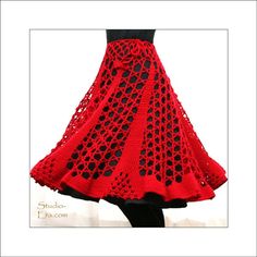 a woman's red and black crocheted skirt with an openwork design