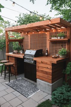 Outdoor wooden barbecue station with grill and bar stools. House Backyard Ideas, Dream Outdoor Kitchen, Simple Outdoor Kitchen, Concrete Outdoor Kitchen, Shed Tiny House, Outdoor Cooking Spaces, Outdoor Kitchen Decor