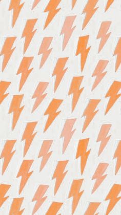 an orange and white pattern with lightning bolts