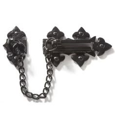 an antique black iron door handle and chain