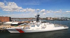 the coast guard ship is docked in the water