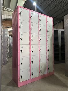 a large pink and white locker in a warehouse