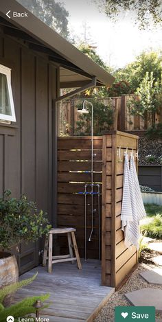 the outside of a house with a shower in it