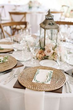 the table is set with place settings for dinner