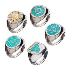 four rings with different designs on them