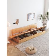 a wooden bench sitting on top of a rug in a living room next to a window