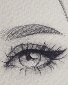 a drawing of an eye with long lashes