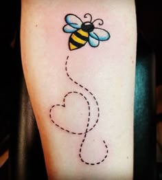 a tattoo with a bee on it and a dotted line in the shape of a heart