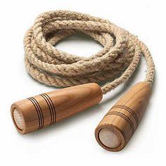 two wooden whistles are on a rope