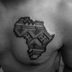 a black and white photo of a man's chest with an african map tattoo on it