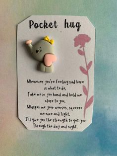 an elephant brooch with a poem attached to it's back and the words pocket hug written on it