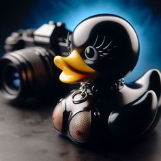 a black rubber duck with a camera on its neck sitting next to it's body