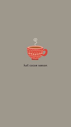 a red coffee cup with the words hot cocoa season written on it