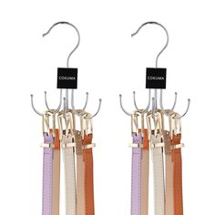 two pairs of metal hooks with leather straps hanging from it's sides and the words columbia on them