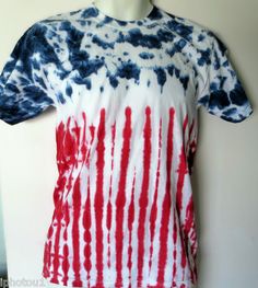 a red, white and blue tie - dyed shirt on a mannequin head