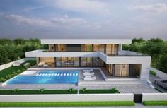 a modern house with a swimming pool in the front yard