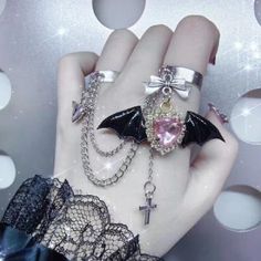 This Gothic Punk Angel Wings Bowknot Cross Ring is the perfect addition to add an edgy touch to any outfit. Multi-layers of cross and wings accents, coupled with bowknot detailing give this ring a truly unique look. Dare to make a statement with this fashionable yet unique ring! Silver Punk Jewelry For Cosplay, Black Punk Style Open Ring Jewelry, Silver Edgy Jewelry For Cosplay, Edgy Silver Jewelry For Cosplay, Silver Alternative Jewelry For Cosplay, Edgy Halloween Rings For Gift, Alternative Metal Jewelry For Cosplay, Edgy Adjustable Rings For Halloween, Alternative Style Halloween Jewelry As A Gift