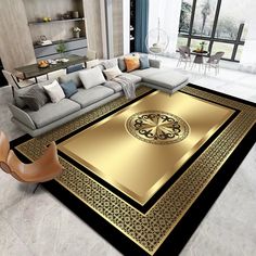 a living room with a large rug on the floor