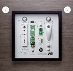 an electronic device is displayed in a black frame with buttons and other parts attached to it