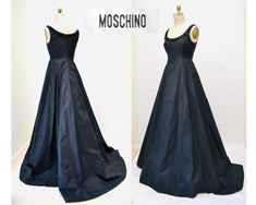 Stunning Moschino Gown features: * Black poly/silk woven body, the fabric is super cool it feels a bit like an active wear woven * Beaded neckline with black enamel discs * Back zip closure  * Extended train Moschino Size US 8 fits like a medium Good condition, would be beautiful paired with a crinoline skirt Bust 34" Waist 28" Hip 48" Length 61" from top of shoulder (off the shoulder sleeves) All measurements are given in full.  Visit the shop  https://www.etsy.com/shop/Hookedonhoney ** twitter | hookedonhoneyvintage ** Instagram | hookedonhoneyvintage Conservative Dresses, Crinoline Skirt, Beaded Evening Gowns, Evening Gown Dresses, Beaded Neckline, Black Silk, Moschino, Dress Clothes For Women, Evening Gowns