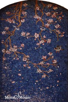 a mosaic tile wall with flowers and birds on the branch, in blue tones by mona mosaic