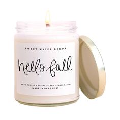 a candle that is sitting in front of a white background with the words pumpkin spice written on it