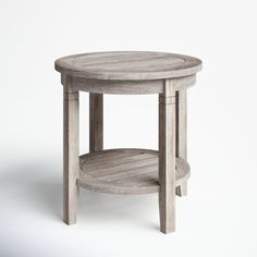 a round wooden table with two shelves on each side and one shelf at the top