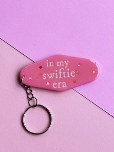 a pink keychain with the words in my swiffie era on it