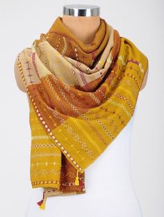 a mannequin with a yellow scarf on it