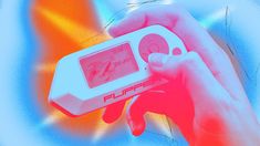 a hand holding a game controller in front of an orange and blue background with the word flipper written on it