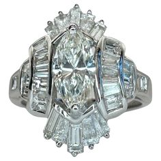 an antique style diamond ring with baguetts