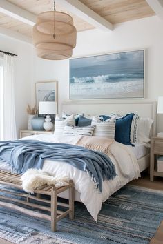 a bedroom with white walls and blue bedding on top of a carpeted floor