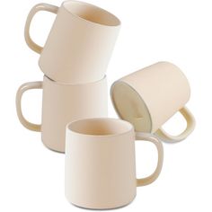 three white coffee mugs sitting next to each other on a white surface with one empty cup in the middle