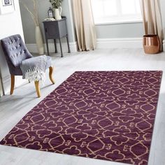 a living room with a purple rug and chair