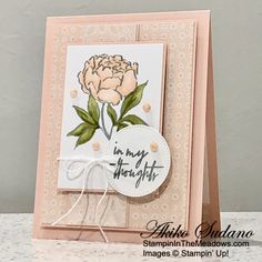 a close up of a card with a flower on the front and back of it