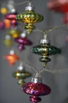 some glass ornaments hanging from a string