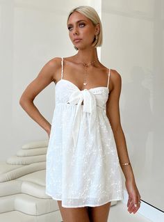 Mini dress 100% polyester Adjustable shoulder straps Tie detail at bust Elasticated back strap Non-stretch Fully lined Frill Mini Dress, Mini Homecoming Dresses, Brunch Dress, Mini Dress White, Wedding Flower Girl Dresses, Polly Dress, Grad Dresses, White Dress Summer, Hoco Dresses