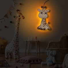 two stuffed giraffes sitting next to each other in a child's room