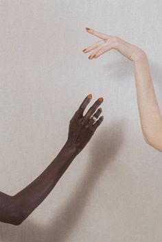 two women reaching out their hands to each other